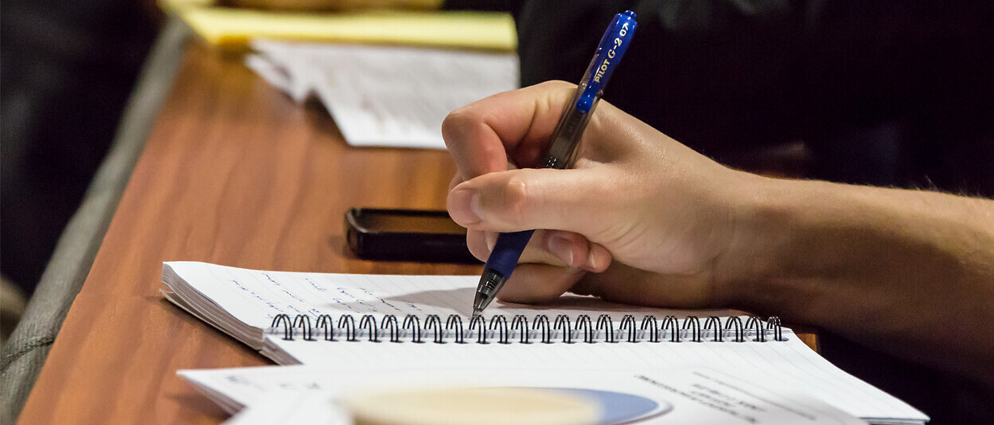 Picture of a student taking notes